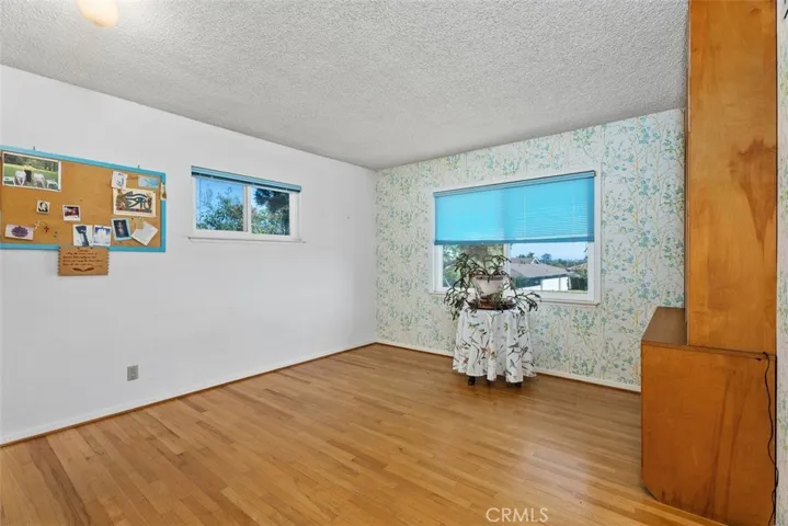 Bedroom two, love the hardwood floor.