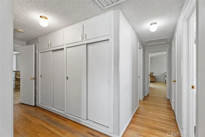 The central hall leads to all 4 bedrooms and tons of storage space.