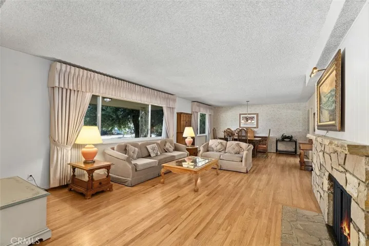 The gorgeous wood floors gleam in the light.