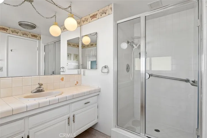 The primary bathroom has a walk in shower.