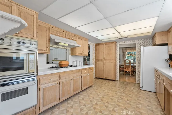 The kitchen opens to the dining and family rooms.