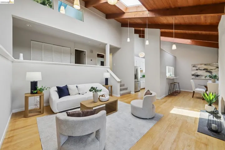 Vaulted wood-beamed ceilings with skylights