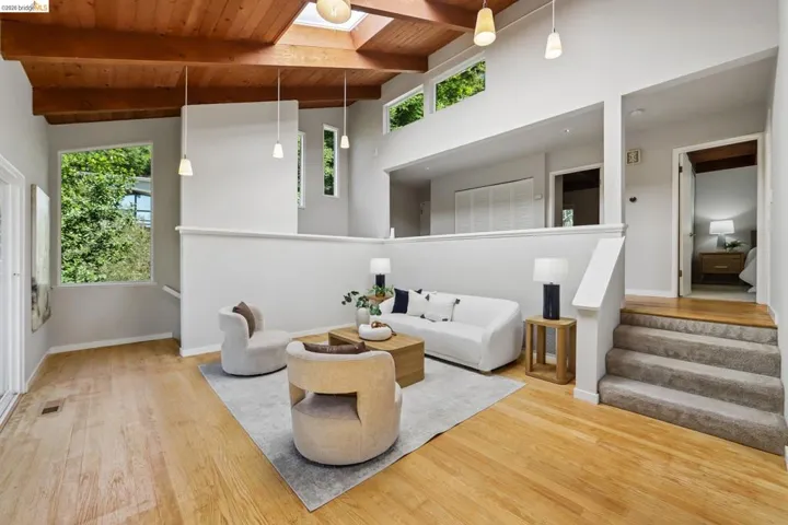 Vaulted wood-paneled ceiling with exposed beams and skylights