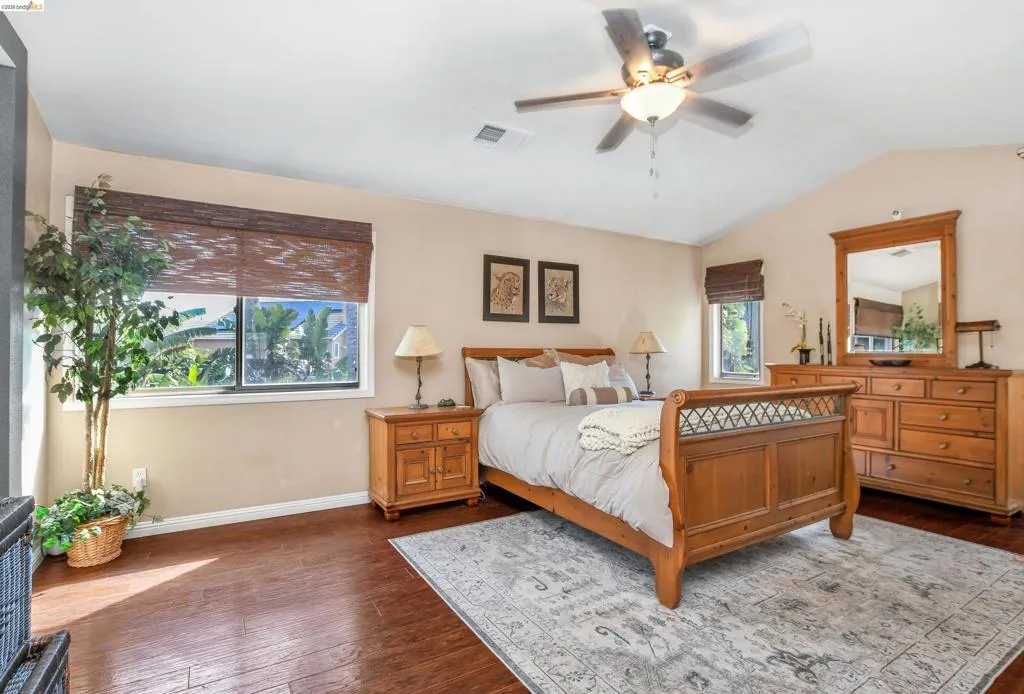 Vaulted ceiling with a central fan light fixture