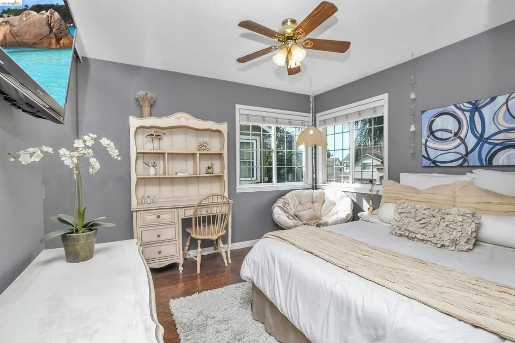 Bedroom featuring hard-surface flooring and painted walls