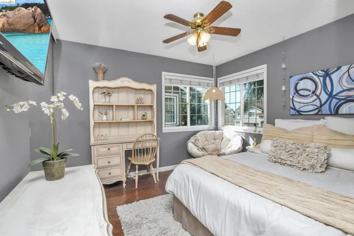 Bedroom featuring hard-surface flooring and painted walls