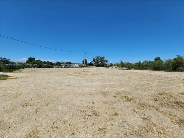View across the building pad with the entry driveway to the lot at the middle left side of photo.