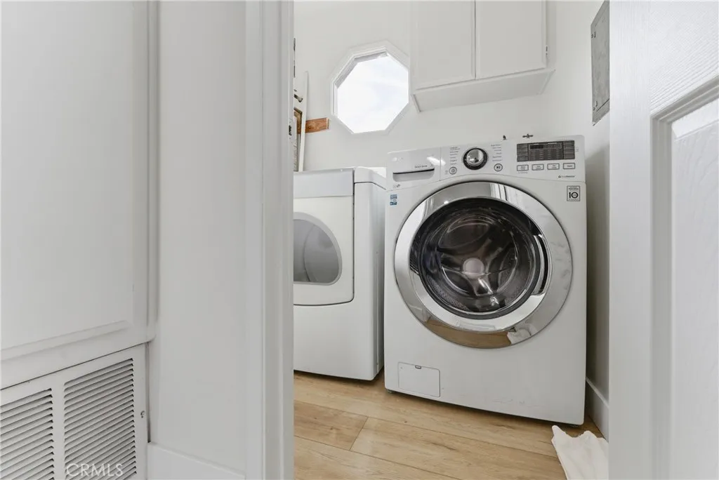 upstairs laundry with Tankless water heater
