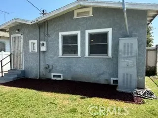 Exit from laundry room to backyard with newer hot water heater