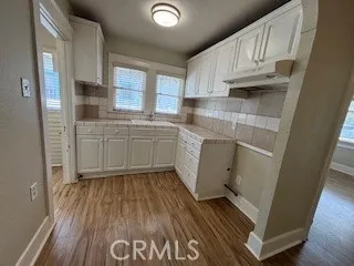 Kitchen with tiled counters & Newer light fixture