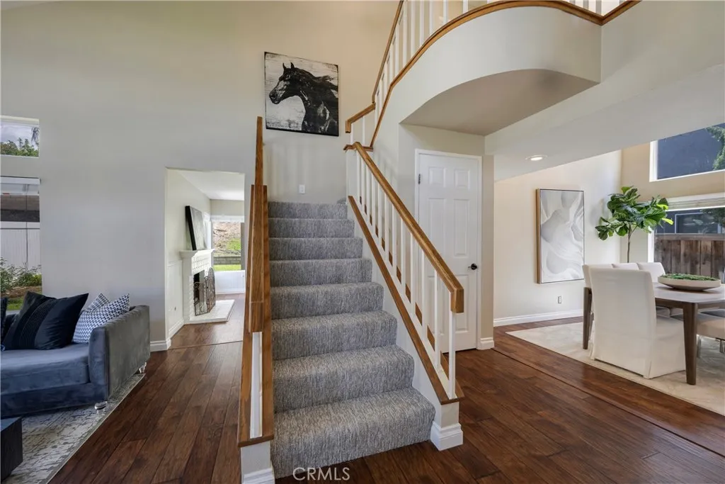 Dramatic stairway leads to Primary & 2 secondary bedrooms.