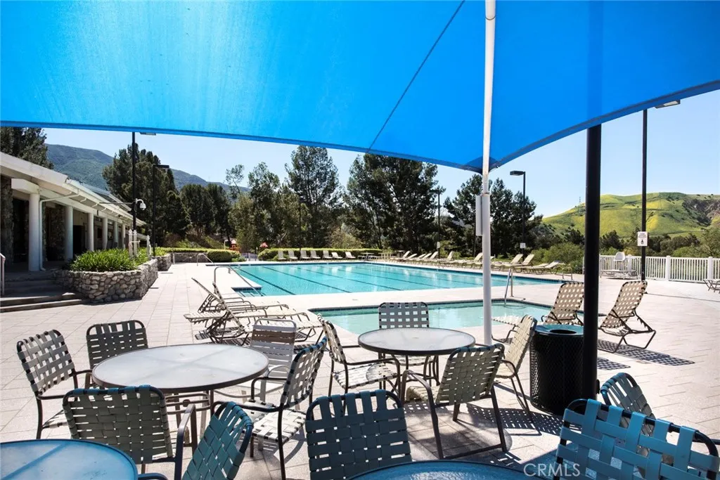 BBQ area next to children’s pool and Association clubhouse.