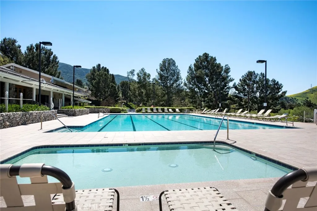 Relax and lounge while watching the children and the kids pool.