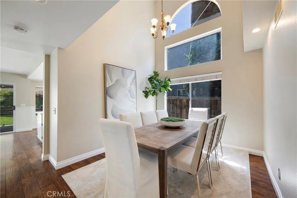 Separate dining room off raised entry walkway has dramatic location for holiday dinners.