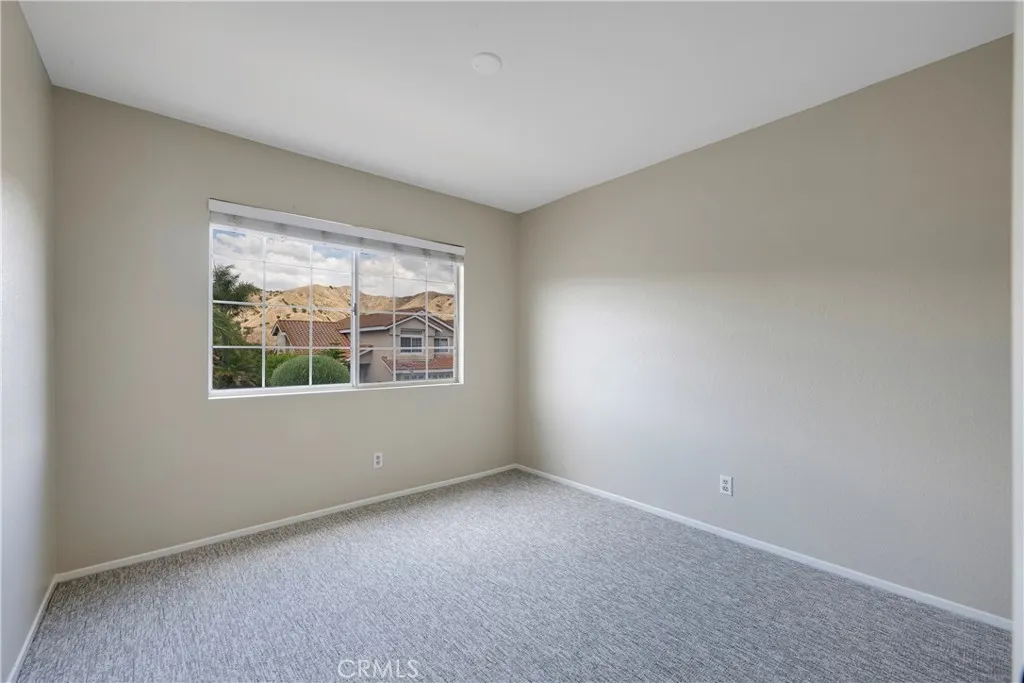 Street facing secondary bedroom has views of the hills.