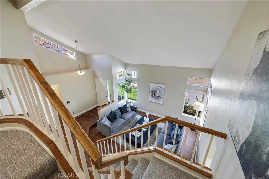 View of living room from top of stairs.