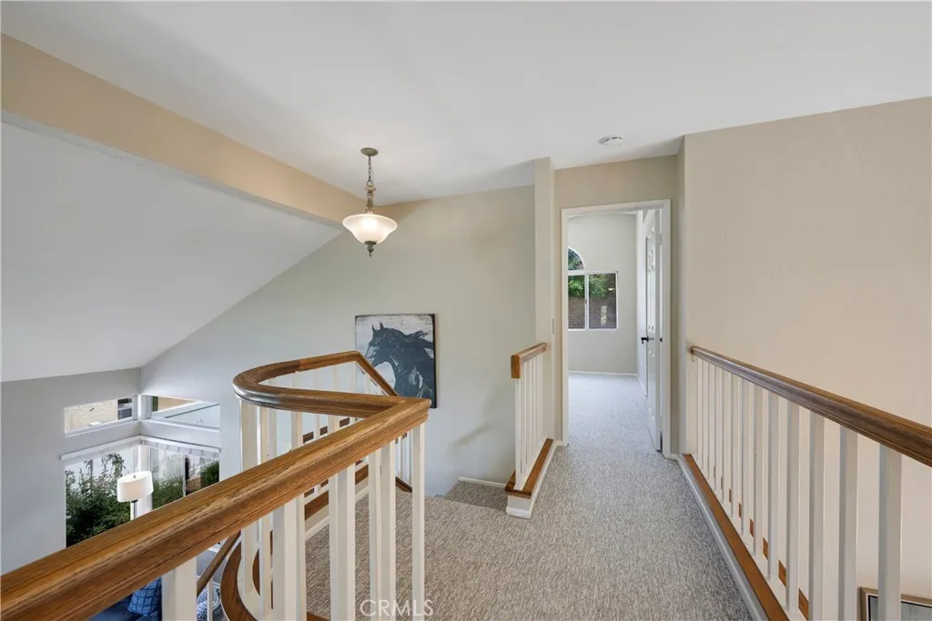 Primary bedroom is closest to the top of stairway.
