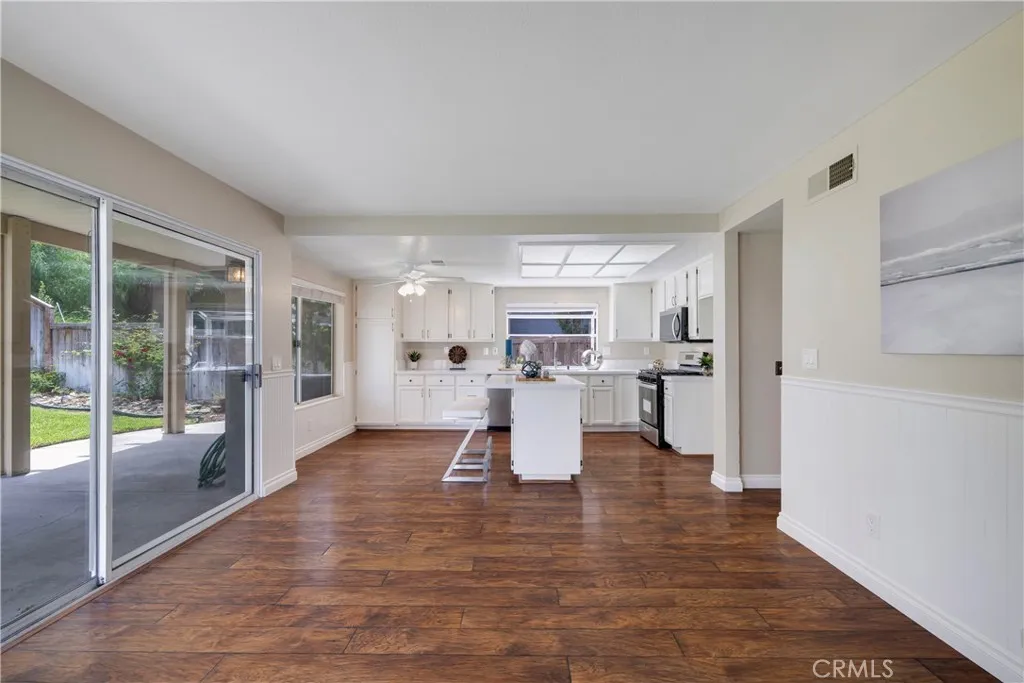 Family room slider leads to back yard covered patio.