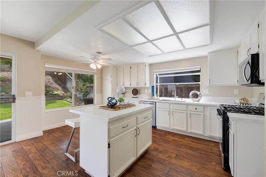 Kitchen boasts island with breakfast bar.