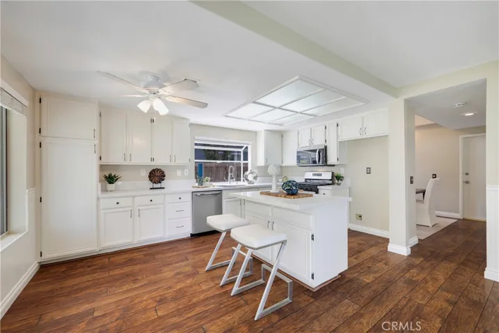 Kitchen features abundant storage cabinetry & pantry.
