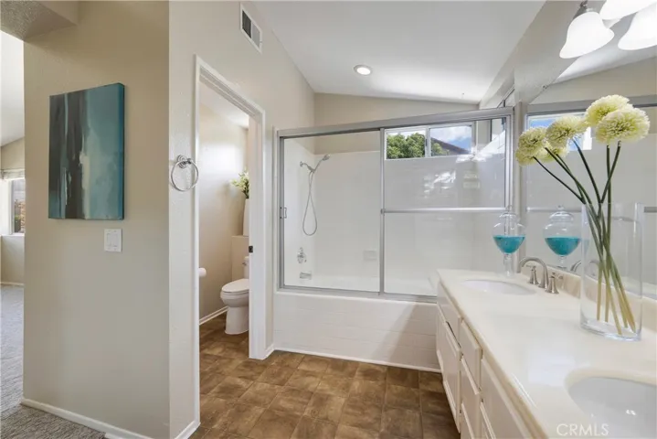 Primary bathroom has a tub/shower combination.