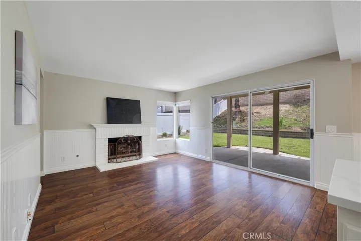 Family room boasts decorative wainscoting.