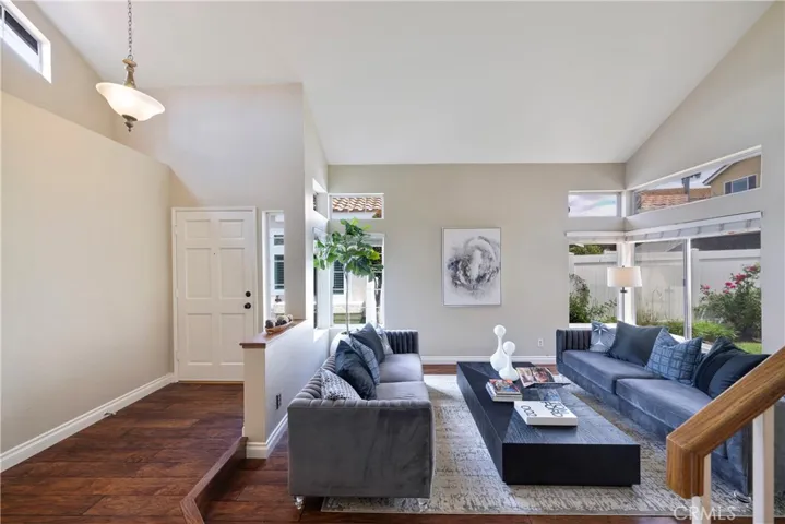 Long entry leads past step down living room.