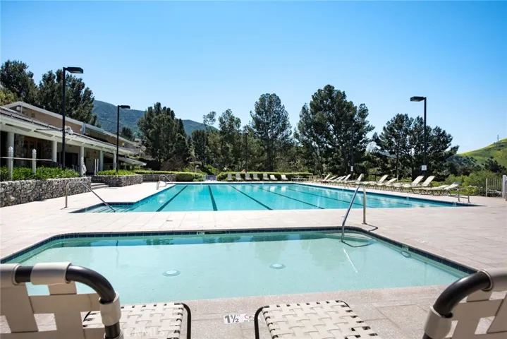 Relax and lounge while watching the children and the kids pool.