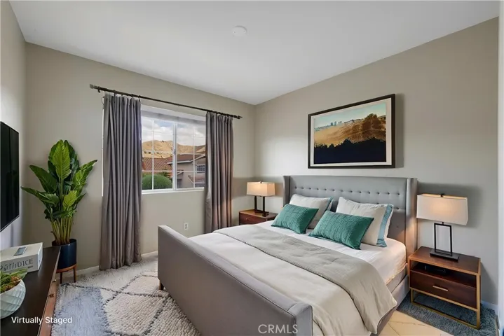 Virtually staged secondary bedroom with street view.