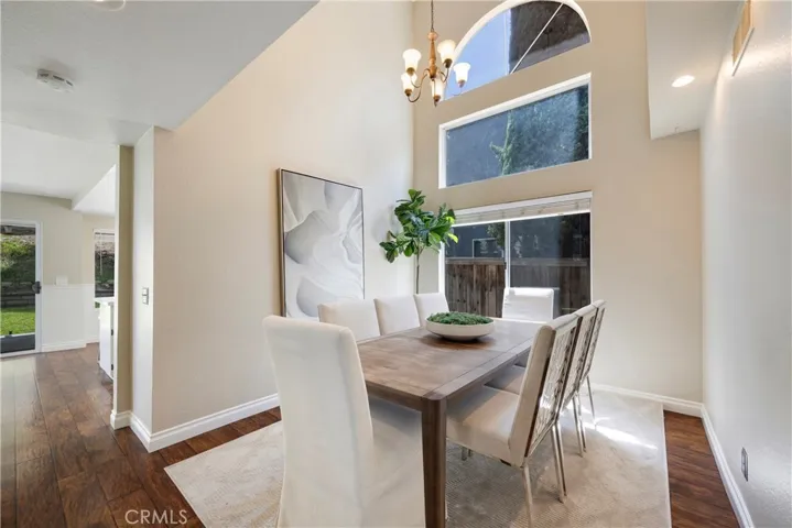 Separate dining room off raised entry walkway has dramatic location for holiday dinners.