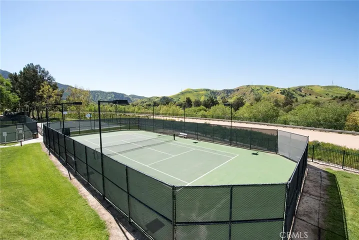 Association tennis court has lights.