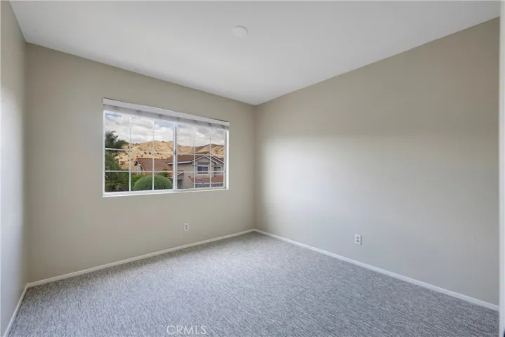 Street facing secondary bedroom has views of the hills.