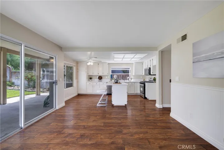 Family room slider leads to back yard covered patio.