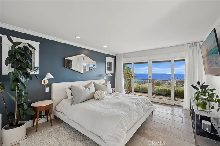 One of two possible primary suites, complete with sliding glass door leading to a private covered balcony.