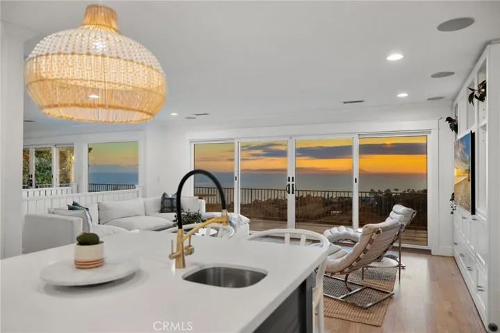 Kitchen island with breakfast bar opens to the family room for entertaining ease.