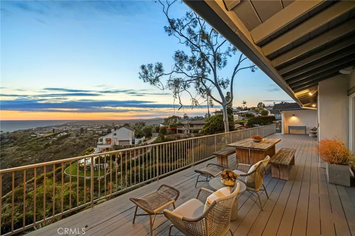 Private and expansive deck runs the length of the home.