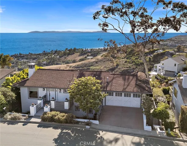 Set on an elevated view lot with an unobstructed vantage point, this impressive, fully remodeled Top Of The World home captures panoramic views of the Pacific, Catalina Island, lush canyon, city lights, and the dramatic coastline stretching to Palos Verdes.