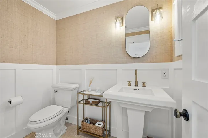 Upstairs powder bath is located off the living room.
