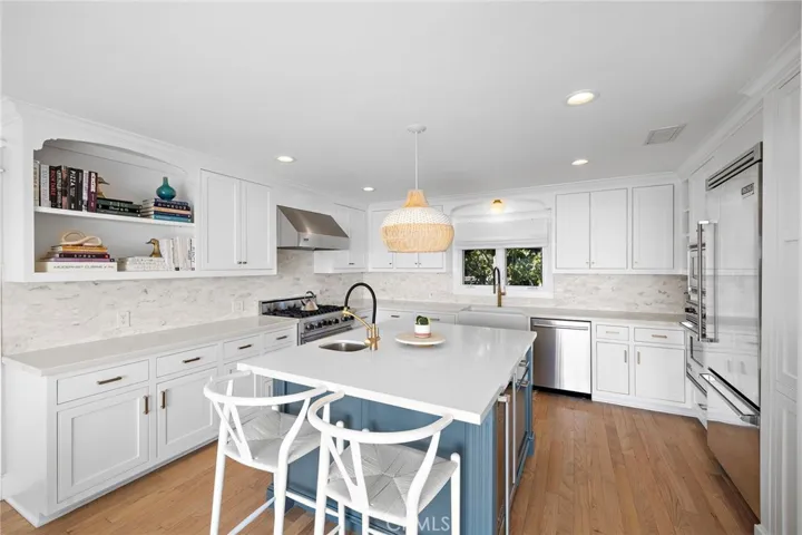 Kitchen with breakfast bar seating.