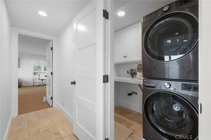 Laundry room is conveniently located by the bedrooms on the lower level.