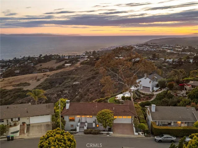 Aerial view of the property shows the proximity to the coast and town.