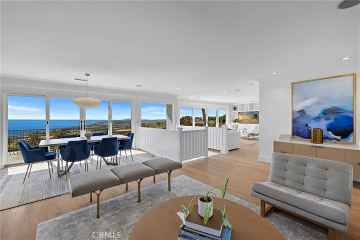 sliding doors leading to the expansive deck to enjoy the sunset. A separate family room is located off to the right.