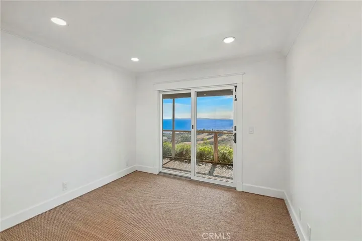 One of two guest rooms. All bedrooms feature sliding doors leading to the private, view patio.