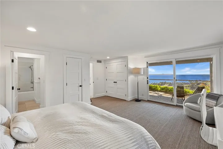Second possible primary bedroom with the same amazing views and entrance to the covered patio.