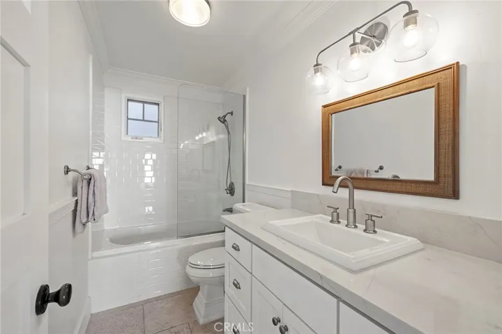 Full hall bath is shared by the two guest rooms.