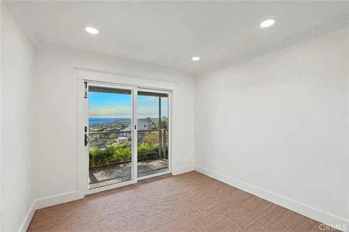 One of two guest rooms. All bedrooms feature sliding doors leading to the private, view patio.
