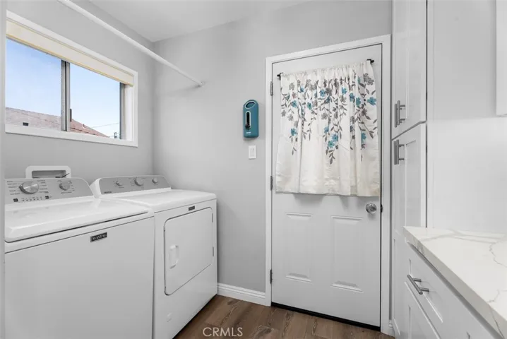 Laundry area off the kitchen next to rear door
