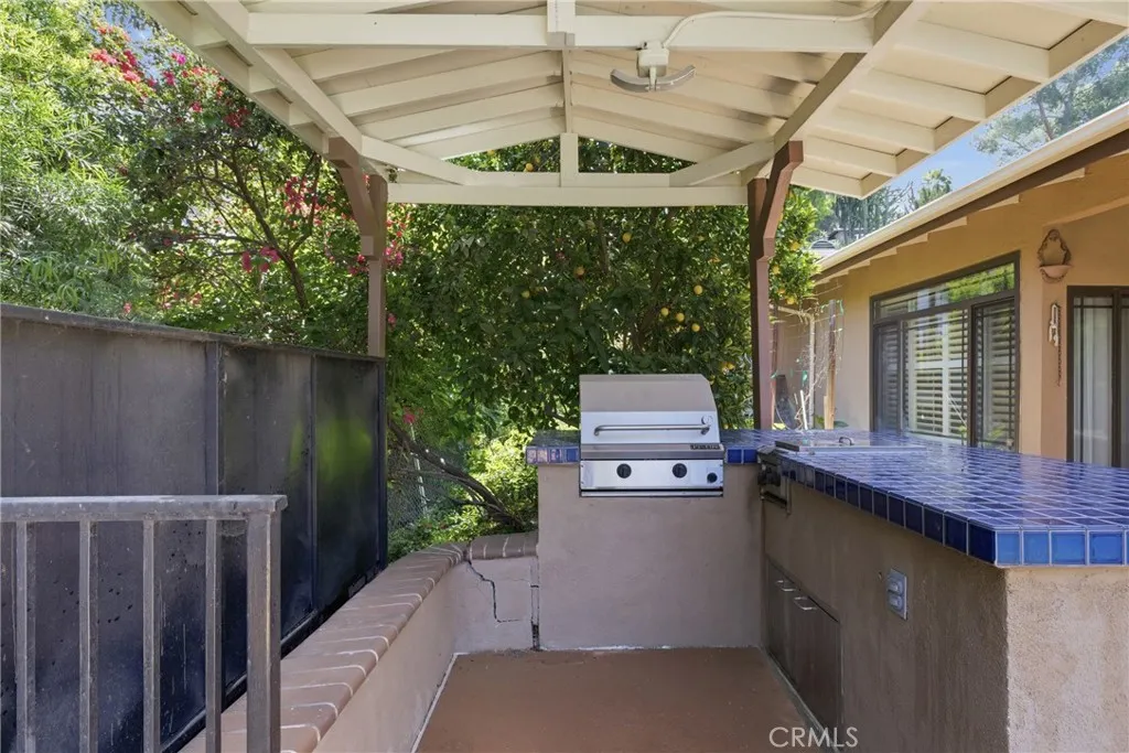 Outdoor kitchen with built-in BBQ