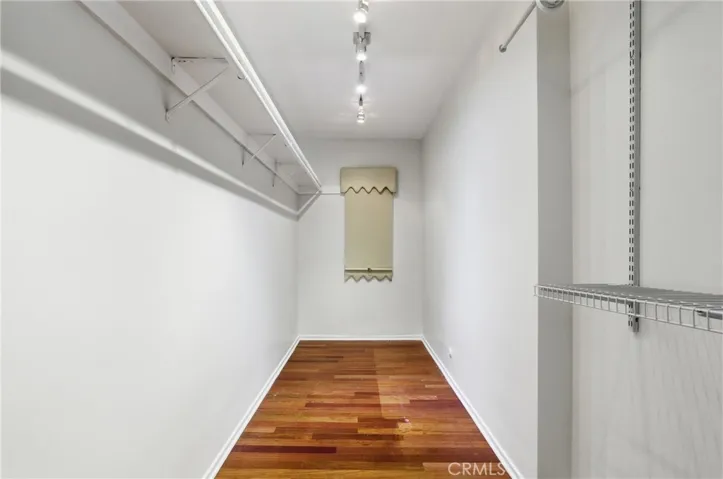 Primary bedroom walk in closet
