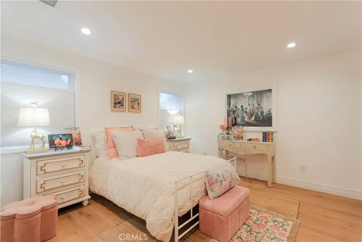 This secondary ensuite bedroom is thoughtfully styled with charm, warmth, and a soft inviting ambiance for every little girl to feel safe and creative.